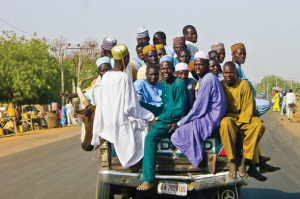 23 men and 1 bovine in the back of a mini-truck in Northern Nigeria.